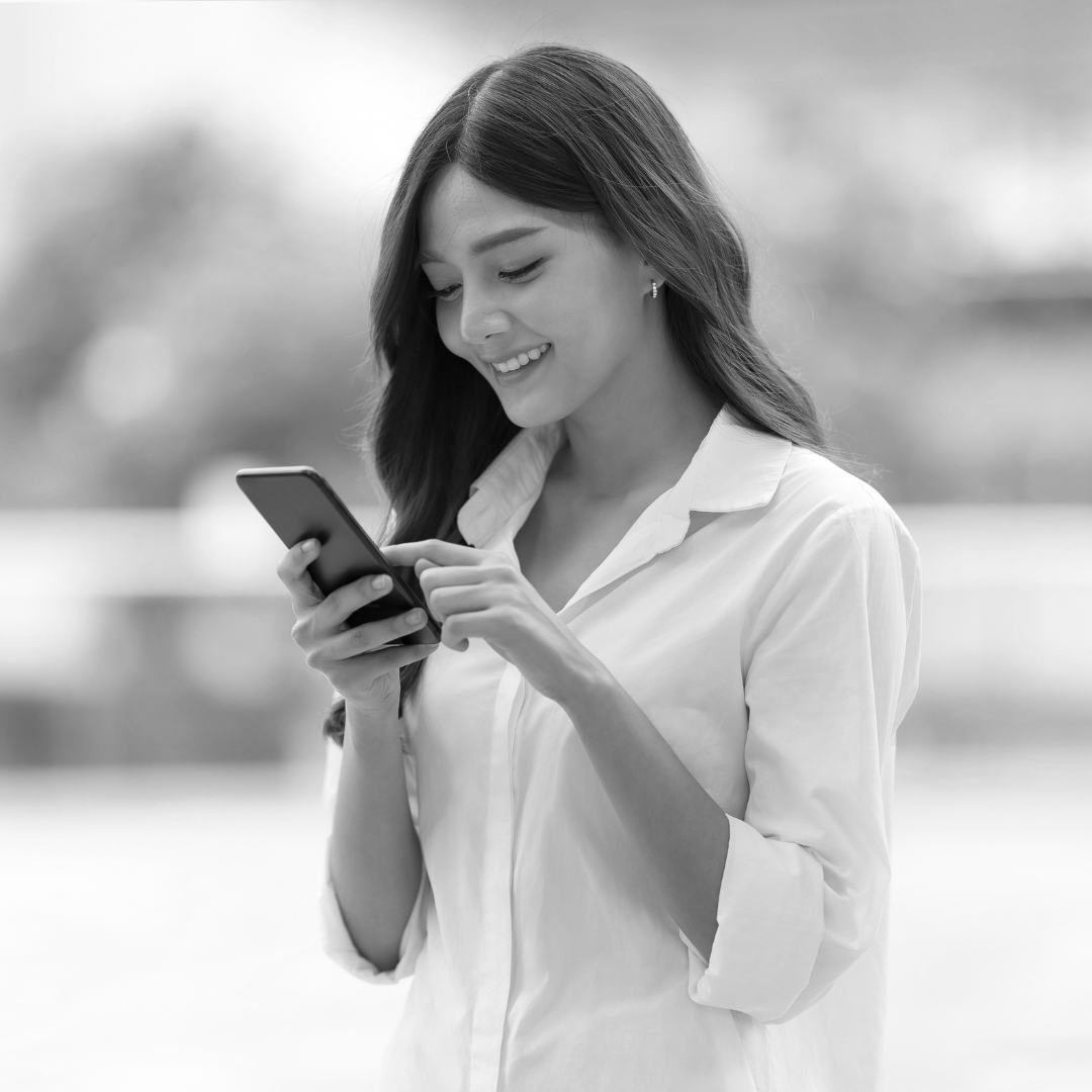 Woman happily finding answers via text