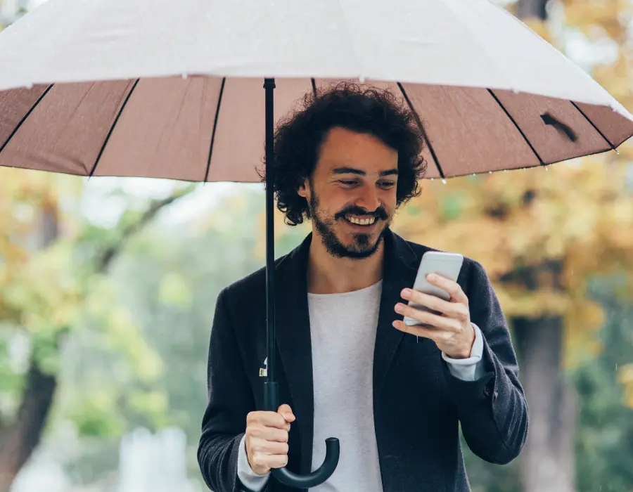 resident smiling in rain